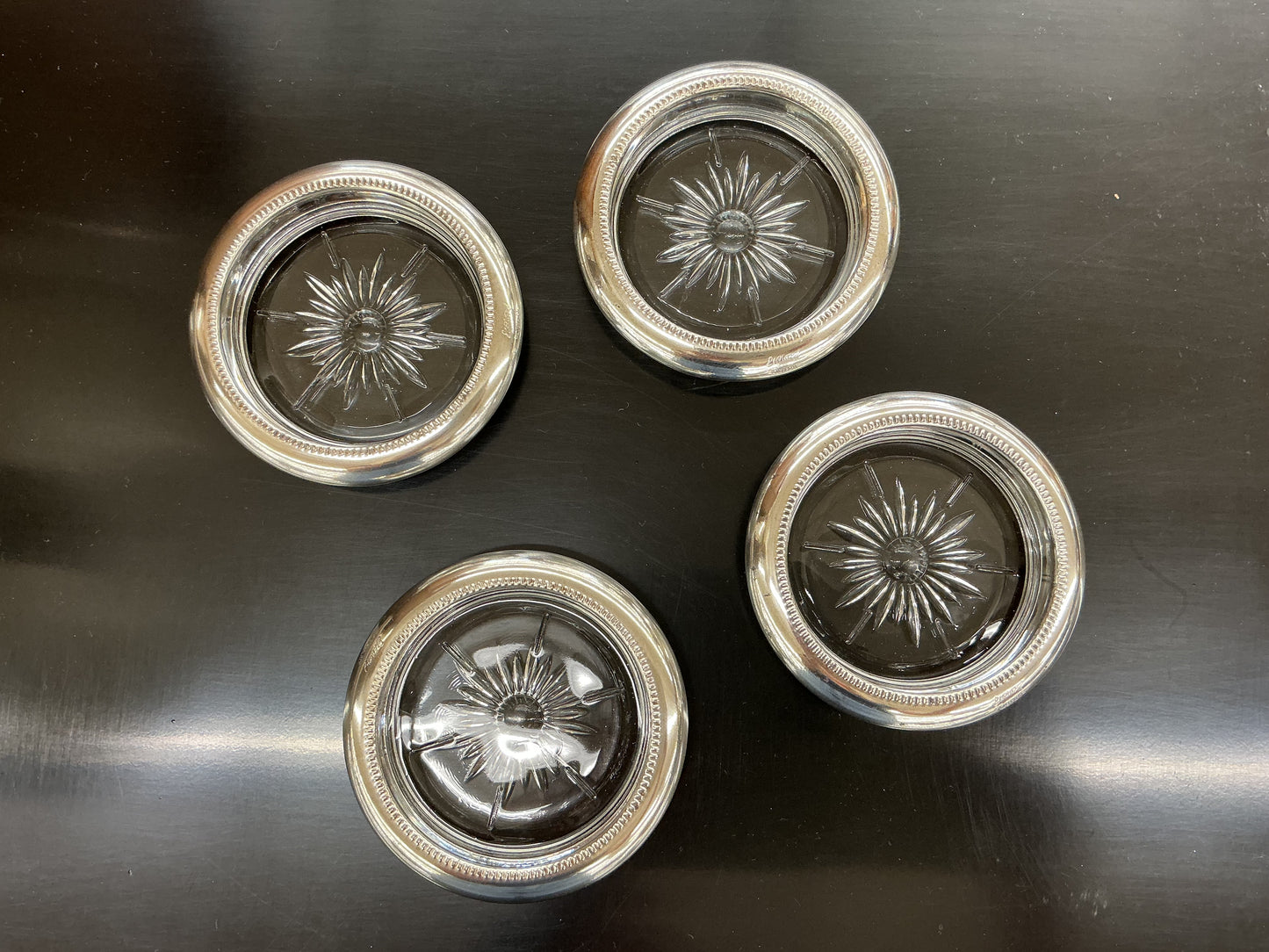 Set of four vintage silverplate and cut glass coasters